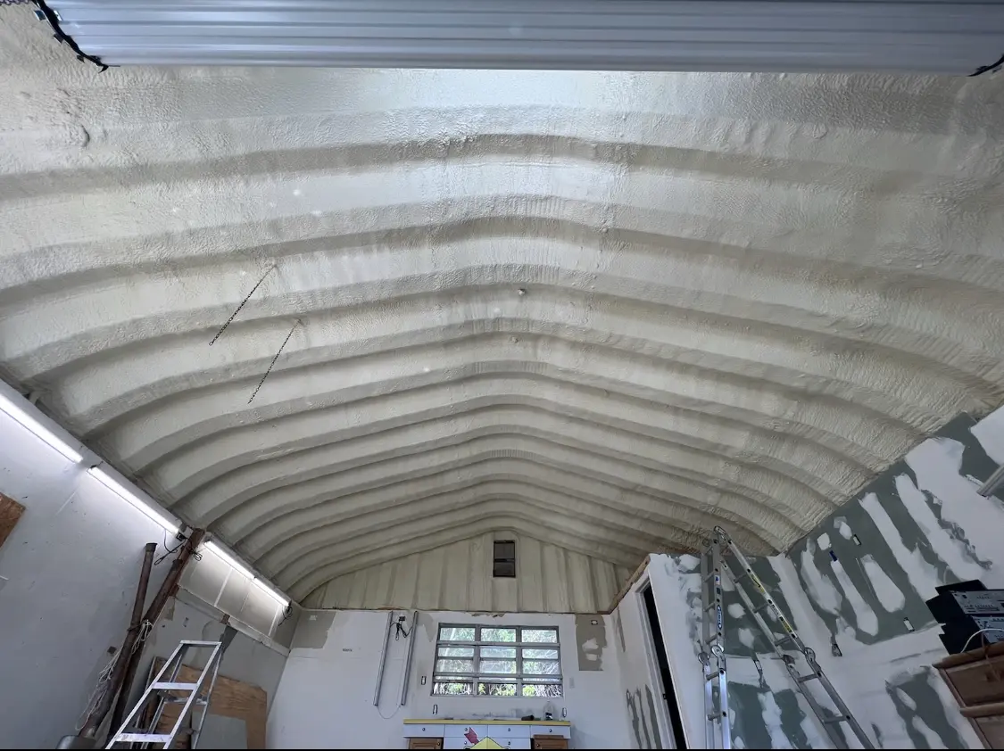 Spray polyurethane foam applied to the underside of a metal roof deck in Lehigh